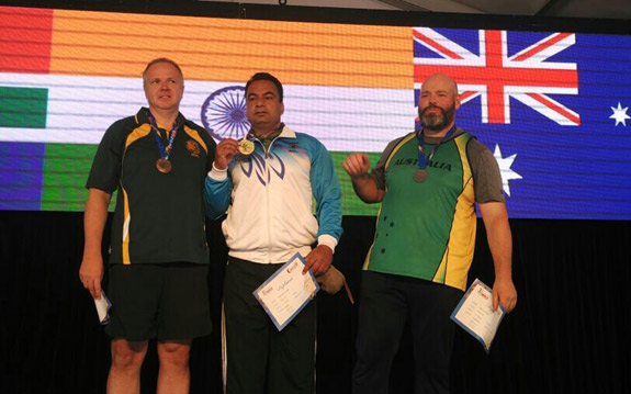 Pakinder Singh proudly displaying the Gold Medal