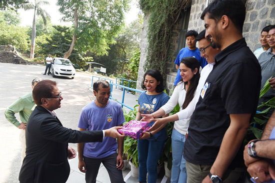Director (HR) felicitating the team members with sweets