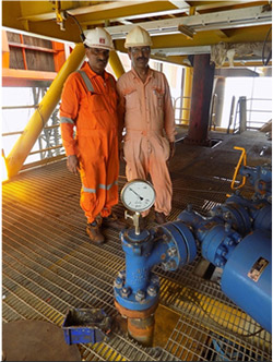 PK Bhardwaj, SE(P) and CV Fapale, SE(P) of the B&S Asset Wellhead Team at the C24-P4#3 X-Mass tree on 27 July, 2016 steering the well to flow to NQO platform