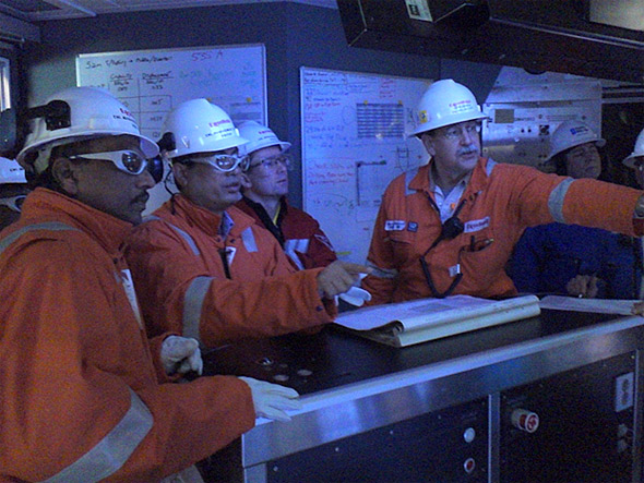 Seen in the picture (extreme left), Director (Operations) in discussion with Consortium Partners in Control Room on board Berkut Platform
