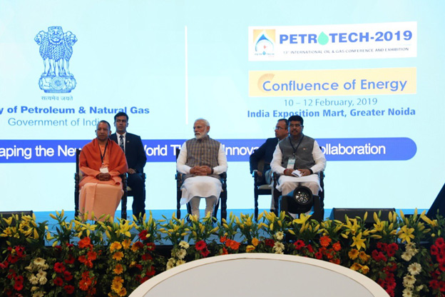 Prime Minister Narendra Modi, UP Chief Minister Yogi Aditya Nath and Minister of Petroleum and Natural Gas and Skill Development and Entrepreneurship Dharmendra Pradhan on the dais