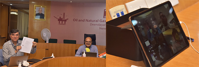 The MoU was signed through Virtual Conferencing. ONGC Director (Finance) and Business Development & Joint Ventures holds up the signed MoU
