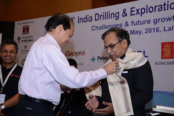 U N Bose being felicitated by former Petroleum Secretary G C Chaturvedi