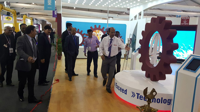 Director (T&FS) having a look at the displays on offer at the ONGC stall