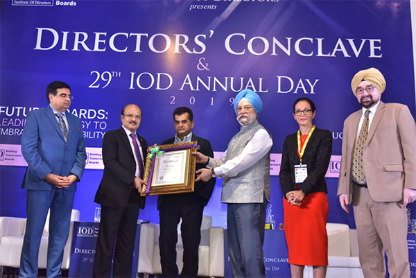 ONGC CMD Shashi Shanker being conferred Distinguished Fellowship of IOD by Union Minister Hardeep Singh Puri